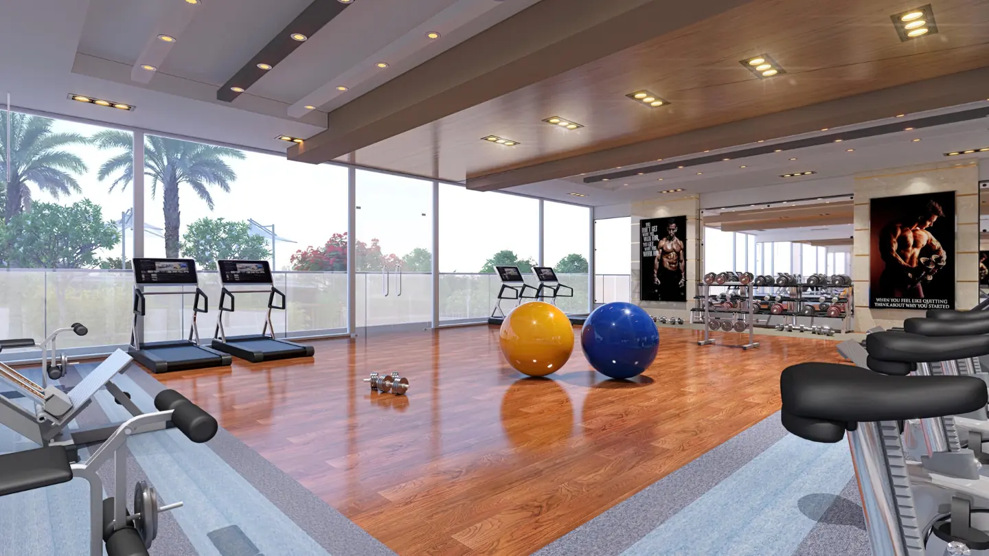 Air-conditioned gymnasium on the third floor of the AIGIN Royal Park clubhouse, NH-24 Ghaziabad, with cardio and strength equipment beside the recreational zone, spa, sauna and yoga room