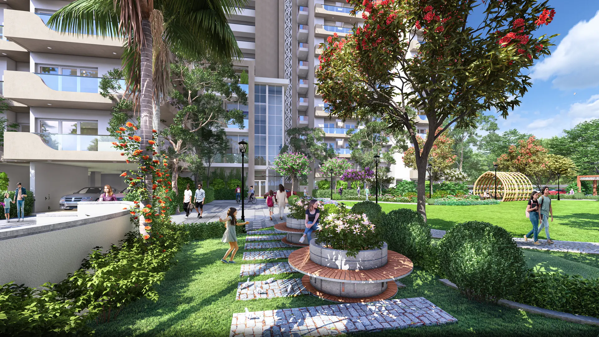 Landscaped garden at AIGIN Royal Park, NH-24 Aditya World City Ghaziabad: a stone walkway past a circular flower planter and a timber pergola tunnel, with a residential tower rising behind